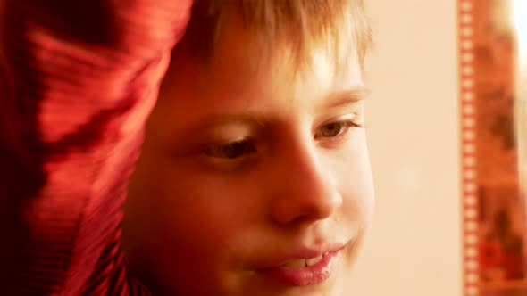 Old home family photo archives theme. Caucasian preschooler examines negative film alt