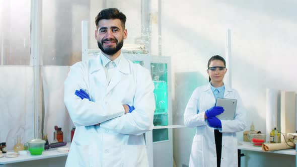 Happy and Excited Woman and Man Scientist Posing alt