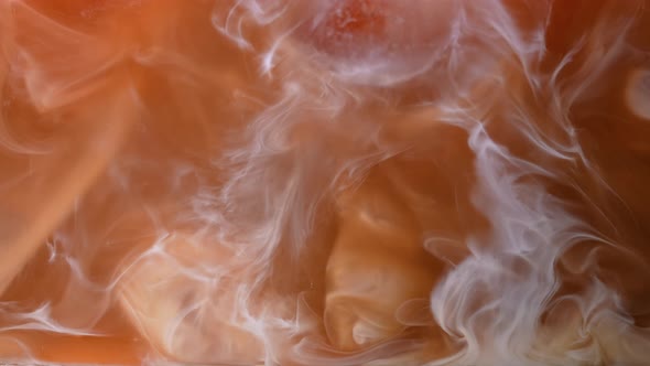 A Dance of Caramel Brown Liquid Between Coffee and Milk Cream with Floating Ice Cubes alt