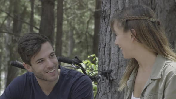 Young couple chatting in woods