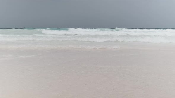 Landscape of Beautiful Tropical Beach with Tidal Waves and Blue Sky Zanzibar alt