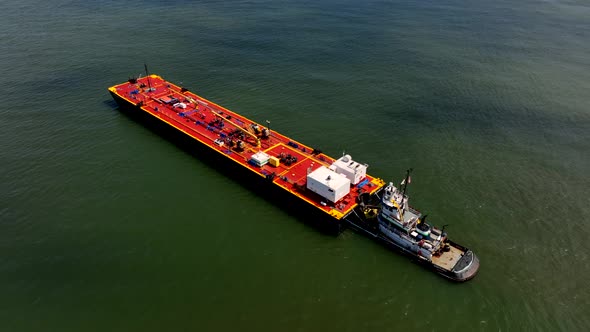 An aerial view of Gravesend Bay in Brooklyn, NY on a sunny day. The shadows from the clouds is on th alt