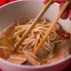 Closeup View on Chinese Cuisine Soup Hand Stirring with Chinese Chopsticks - VideoHive Item for Sale