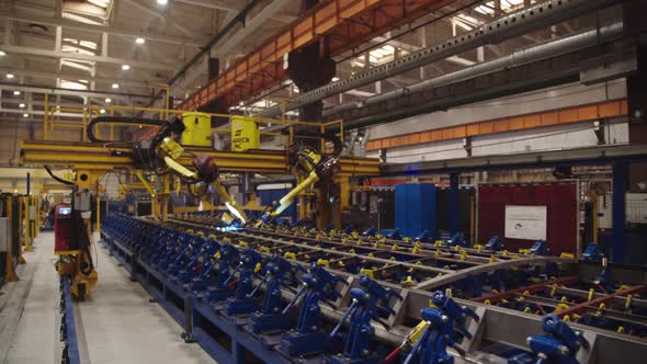 Robotic Welding Arms Weld Structures at the Production Plant