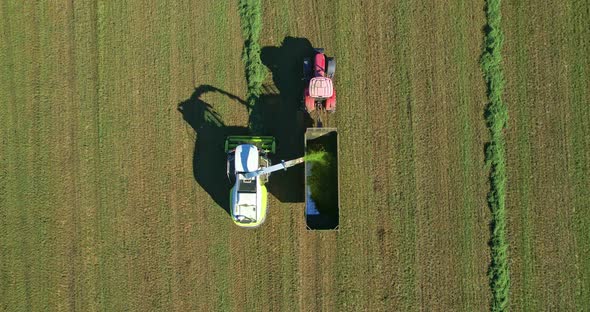 Aerial view of a combine harvester and a truck