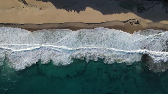 Topdown aerial calm wave action at Injidup beach Western Australia alt