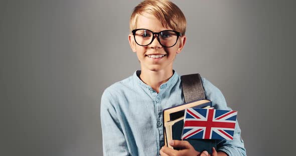 Portrait of Smiling Boy with Books