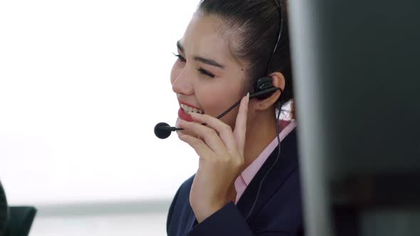 Business People Wearing Headset Working in Office alt