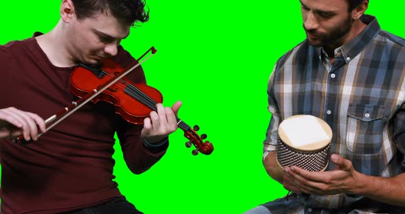 Male musicians playing violin and cabasa alt