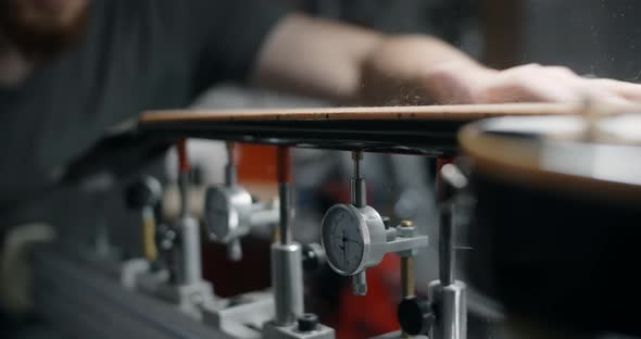 Luthier Brushes Off the Wood Dust From Sanded Guitar Neck Works at the Musical Instruments Repairing alt