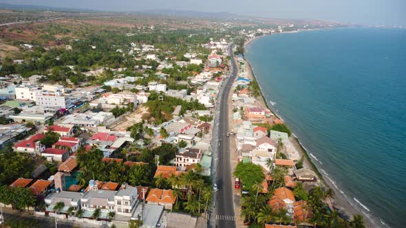 Aerial flyover Mui Ne, Vietnam resort beach town for summer vacation alt