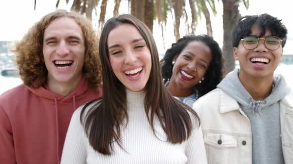 Happy friends group laughing at camera