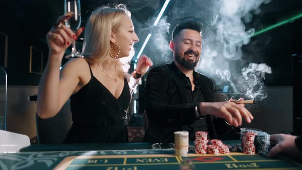 Beauty Young Women and Bearded Man Are Winning and Rejoice in Victory at the Casino alt