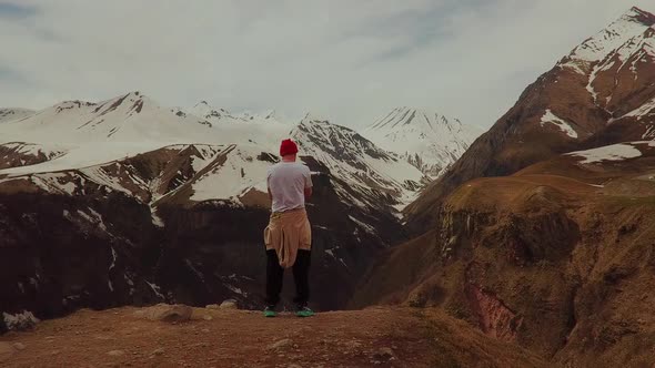 a Figure on Top in the Beautiful Snow Mountains of Georgia