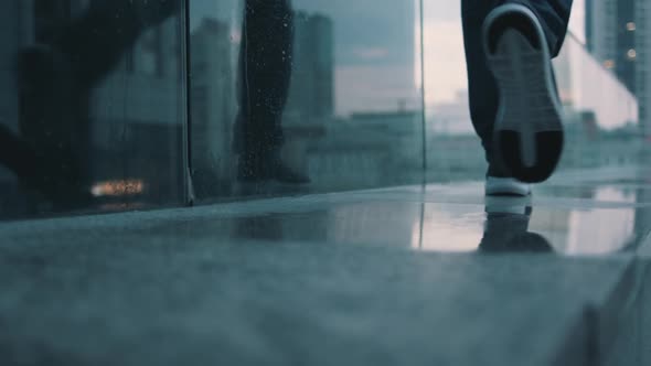 Guy Walks on the Sidewalk Closeup alt