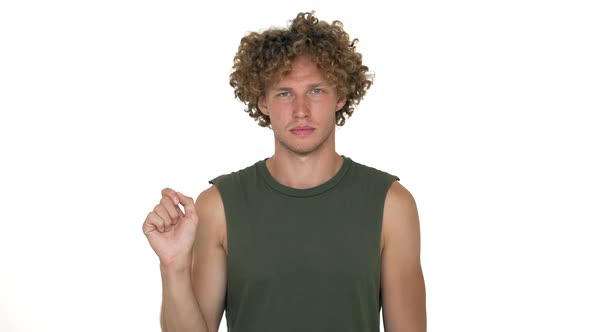 Blond Cheerful Guy with Curly Hair Posing on Camera Playing Like Going Down in Elevator Showing alt