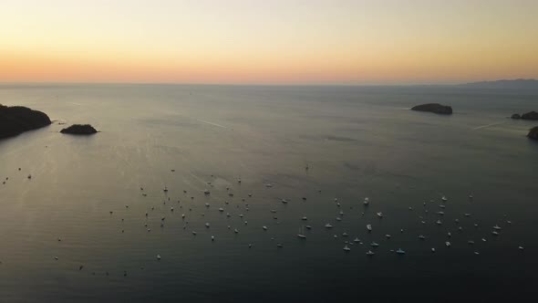 Large group of boats in a beautiful tropical bay. alt