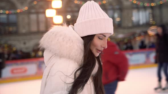 Christmas Ice Rink with a Brunette Girl alt