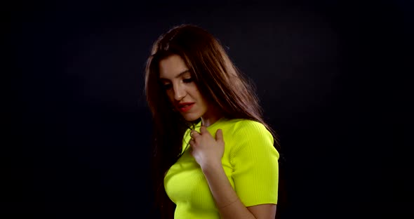 a Portrait of a Brunette with Long Hair, Red Lipstick, Bright Nail Polish and Large Gold Rings. the alt