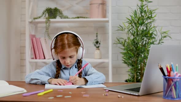 Little Child Girl Using Laptop Computer for Studying Online E-learning System