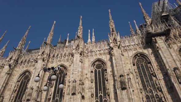 Stone marble sculptures as design elements of the ancient Duomo Church of Milan