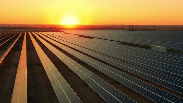 Renewable Energy, Solar Electricity Concept. Photovoltaic Power Field at Sunset in a View From Above alt