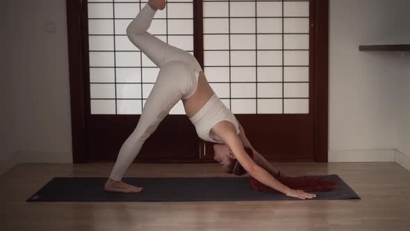Beautiful Young Adult in Sportswear Doing Stretch and Breathing Exercises alt