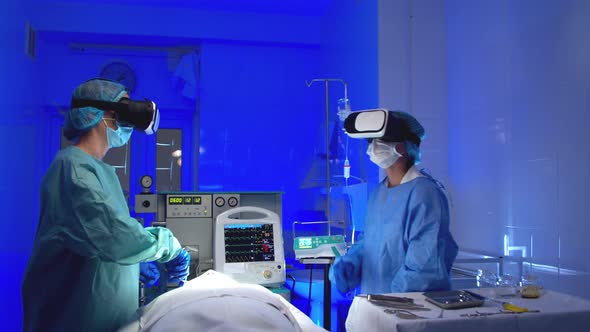 Doctors in VR Glasses Performing Surgery in Hospital