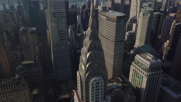 Aerial Descending Close Up View of Top of Chrysler Building with Distinctive Art Deco Crown and alt