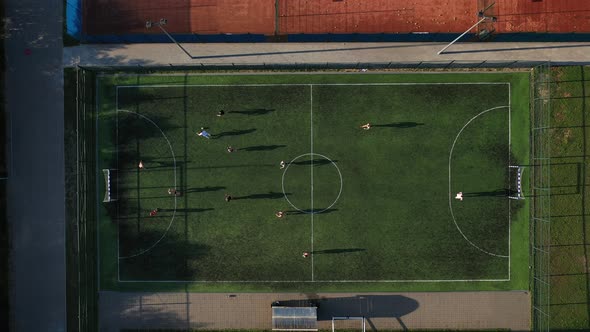 Top View of a Sports Soccer Field with People Playing Soccer.a Small Football Field on the Street in alt