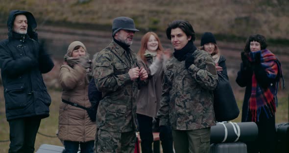 Happy Refugees Applauding Military Soldiers During War, Stock Footage