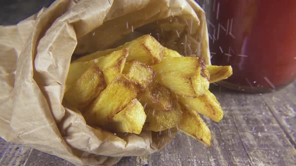 Slow Motion Potatoes in a Package Sprinkle with Salt