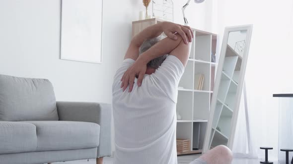 Home Training Warm Up Exercise Man Stretching Arms alt