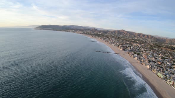 Flying Along Ventura California Usa Coast Above Beach And Waterfront Homes alt