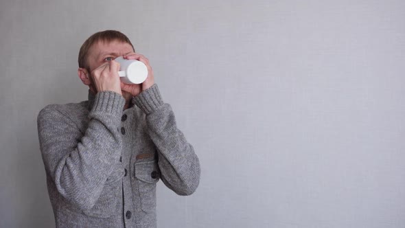 Young Man with a Beard Suffers From Illness alt