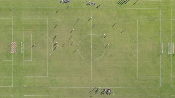 Bird's Eye View of Football Match at Hackney Marshes in London alt