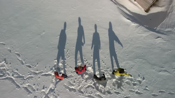 Tourists Had Fun Playing with Their Shadows on the White Snow