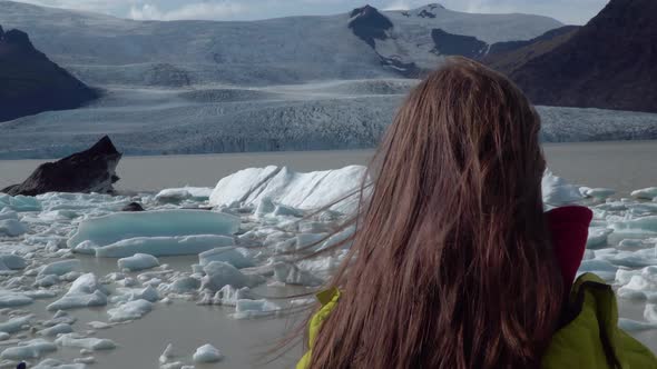 Tourist on Iceland Looking at Jokulsarlon Glacier Lagoon alt