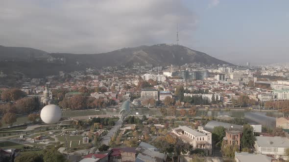 Aerial view of Tbilisi city central park and Bridge of Peace alt