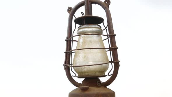 Old kerosene lamp of illumination on a white background.