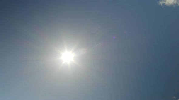 Blue Sky with Sun and Clouds Time Lapse alt