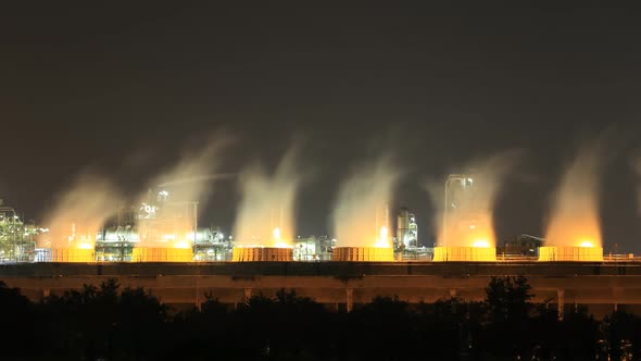 4k Time-lapse of Cooling tower of oil refinery industrial plant at night, Thailand