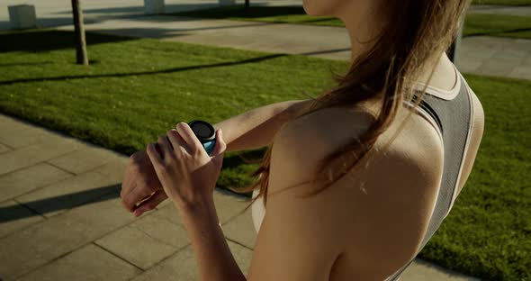 The Girl on the Morning Jog Turns on Her Smart Watch