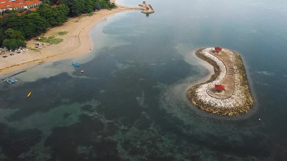 Beautiful cinematic Sanur beach, Bali drone footage with interesting landscape, fishing boats and ca alt