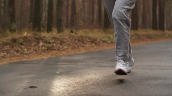 Old Sporty Woman Running in Park alt