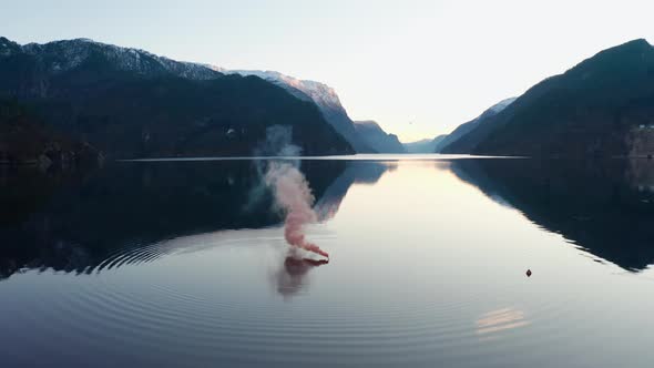 Maritime smoke distress signal at sea - Orange Smoke pouring out alt