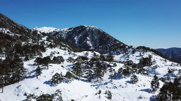 Moving over a snow covered mountain on a clear day