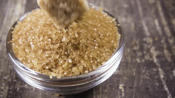 Slow Motion Sugar Cube Falls Into a Bowl of Sugar Close Up