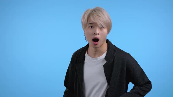 Asian Man Depicts Shock Showing WOW Delight Face Effect alt