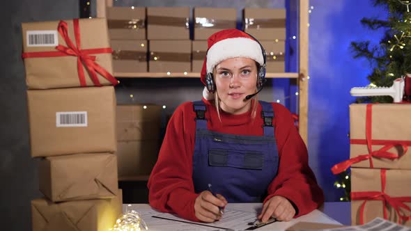 Small Business Owner Caucasian Female Freelancer Santa Works at Home Office Using Computer Takes alt
